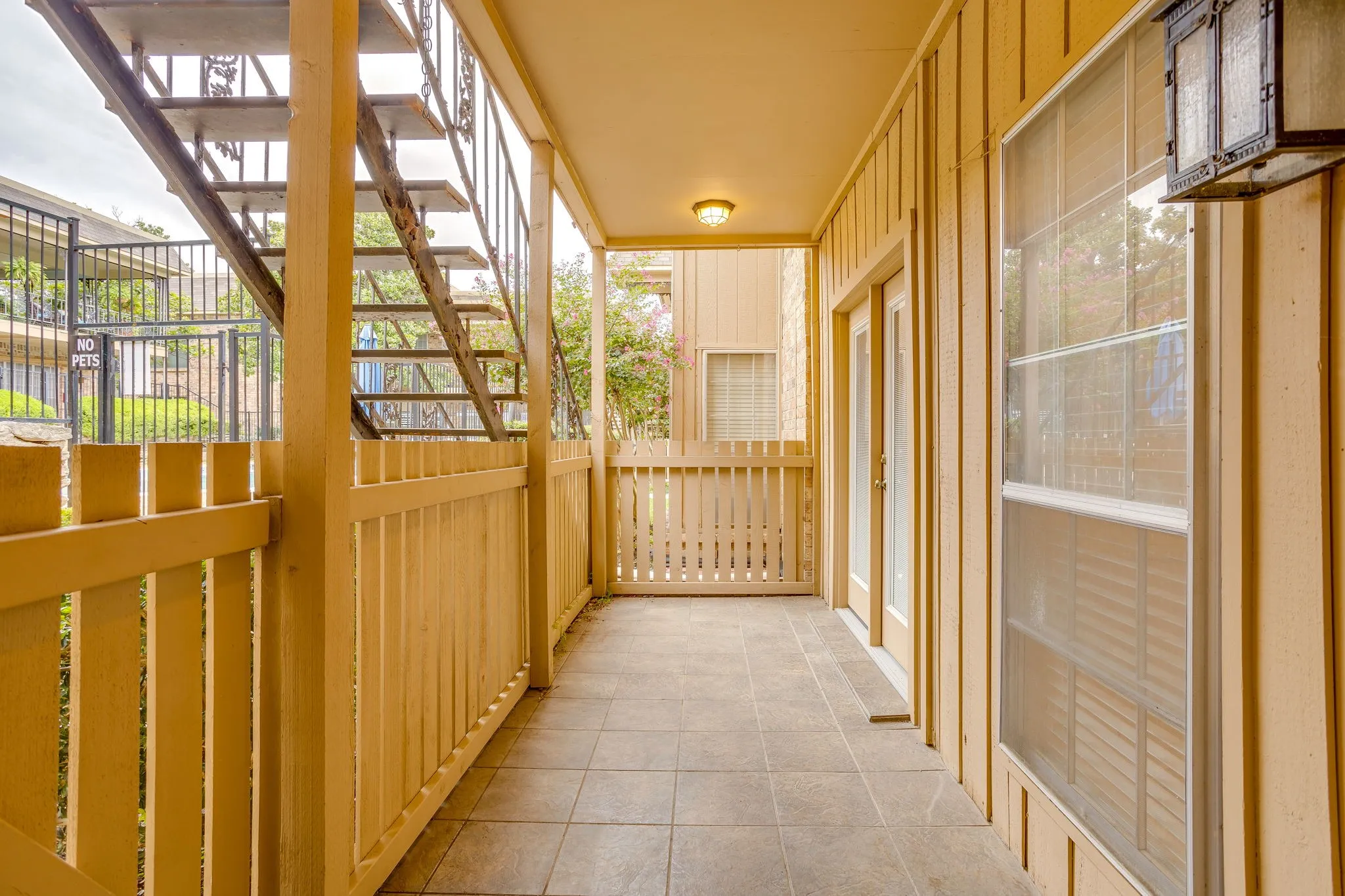 Nice covered porch to relax. You may enter the porch from the kitchen or the french doors from the second living area.