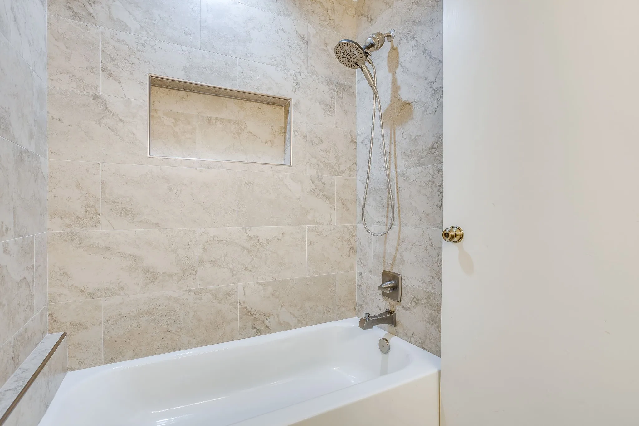 Beautiful newly renovated bathtub and shower.