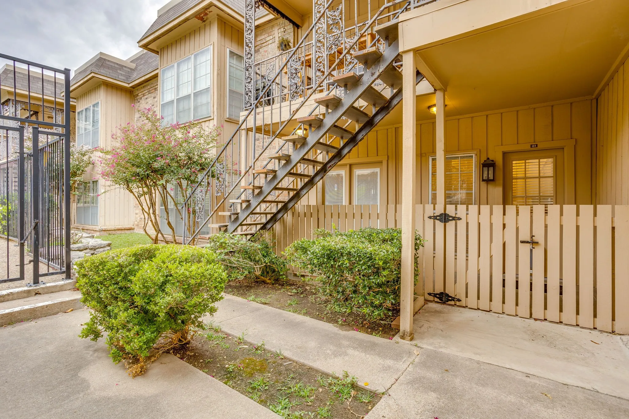 Back porch steps away from the pool and covered parking.