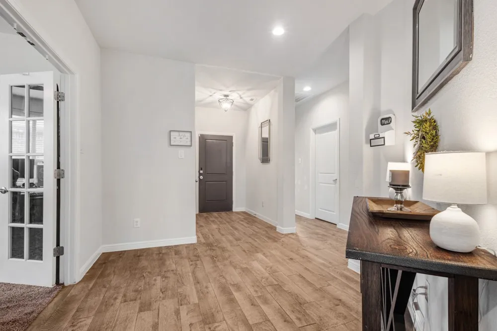 Entryway featuring wood-finish flooring and neutral wall tones