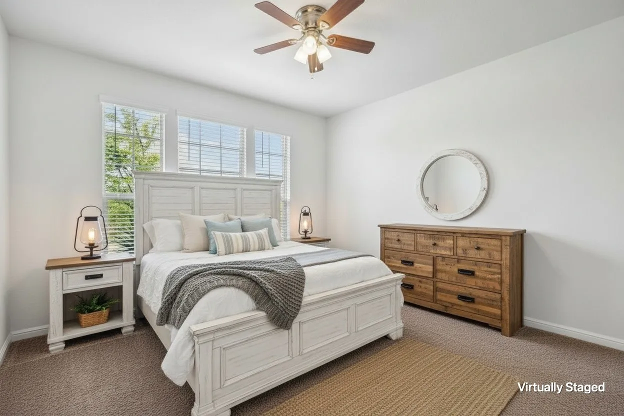 Carpeted room featuring multiple windows with blinds, a ceiling fan with light fixture, and white painted walls