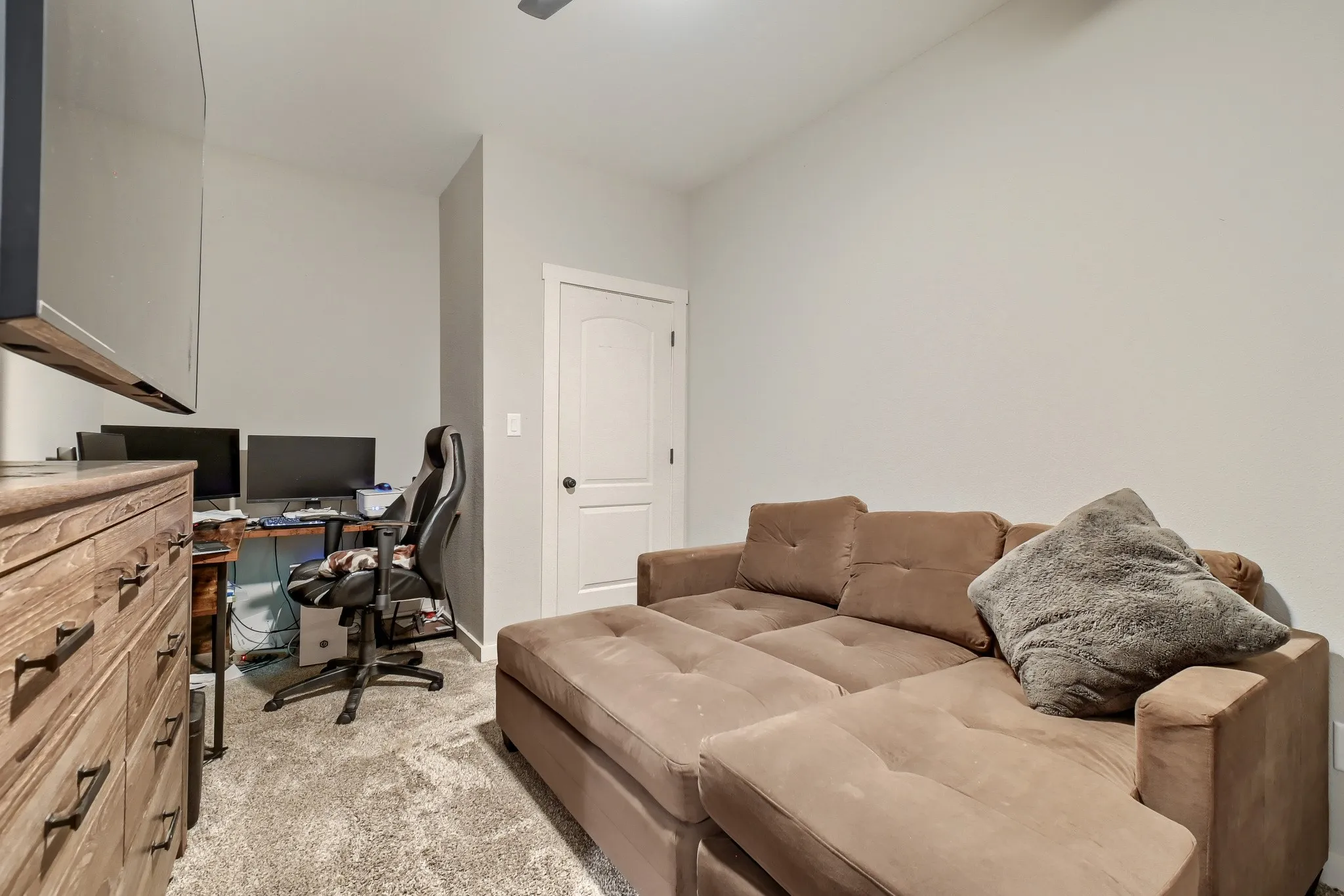 Third bedroom staged as an office space.