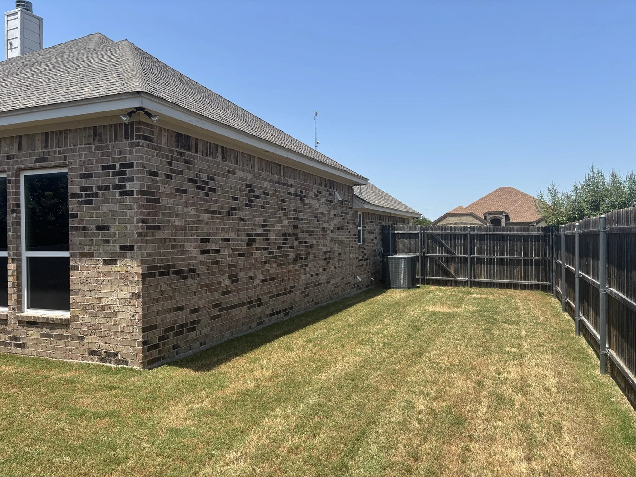 Brick exterior with a gabled roof and white trim