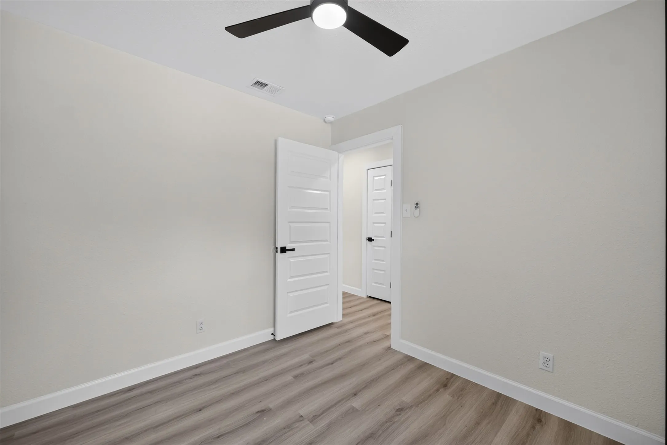 Neutral-toned interior featuring wood-finish flooring