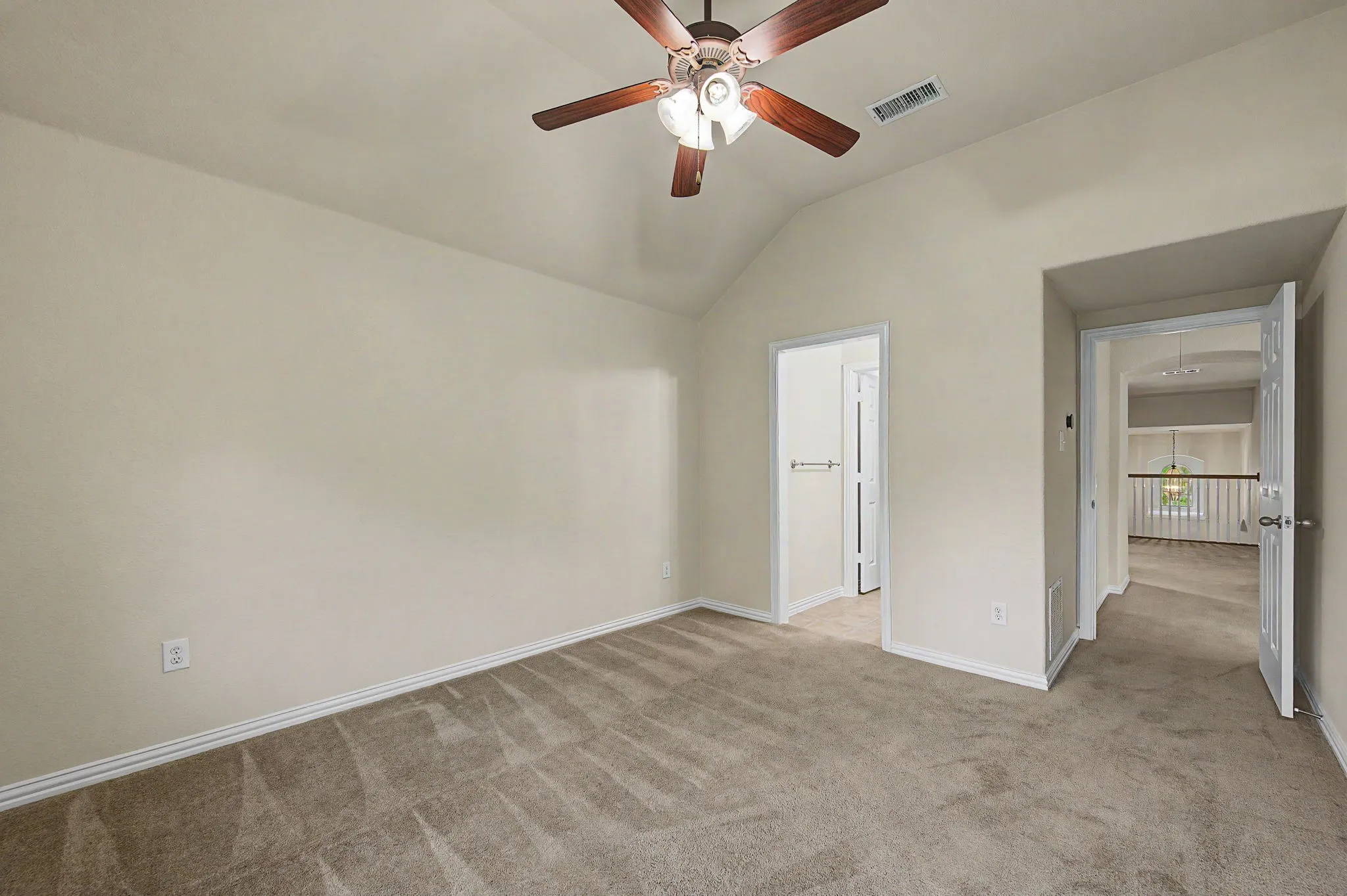 Secondary bedroom on the 2nd floor features a jack and jill bathroom and vaulted ceiling and walk in closet