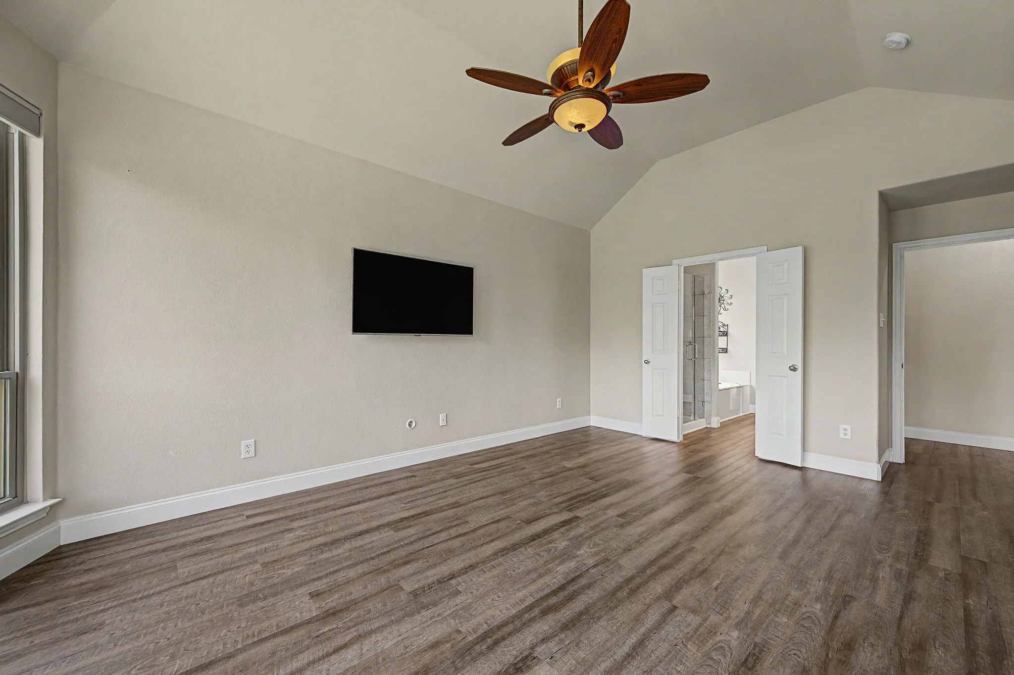 LVP continues from the primary bedroom through the bathroom
