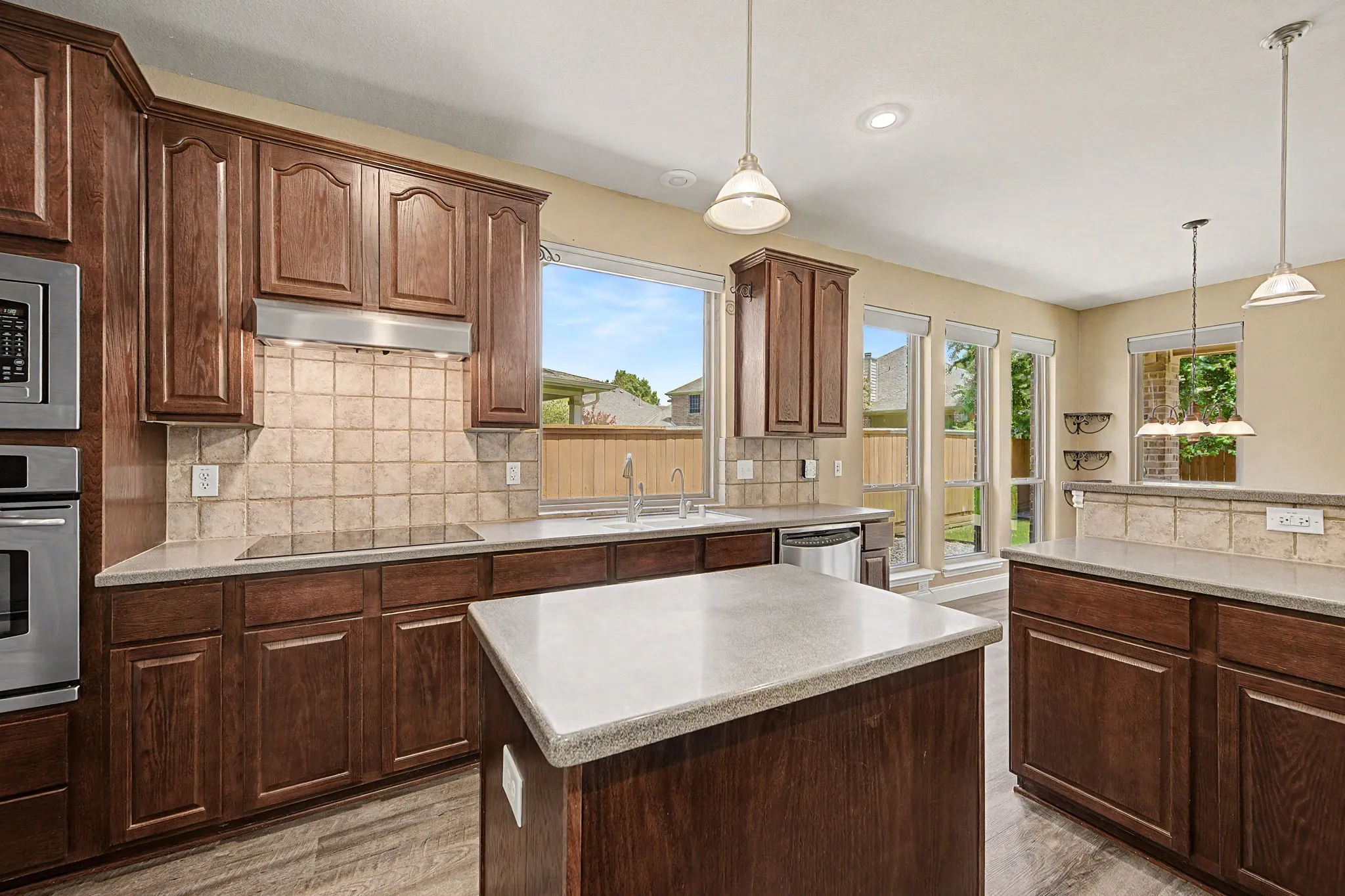 Oak cabinets with corian countertops