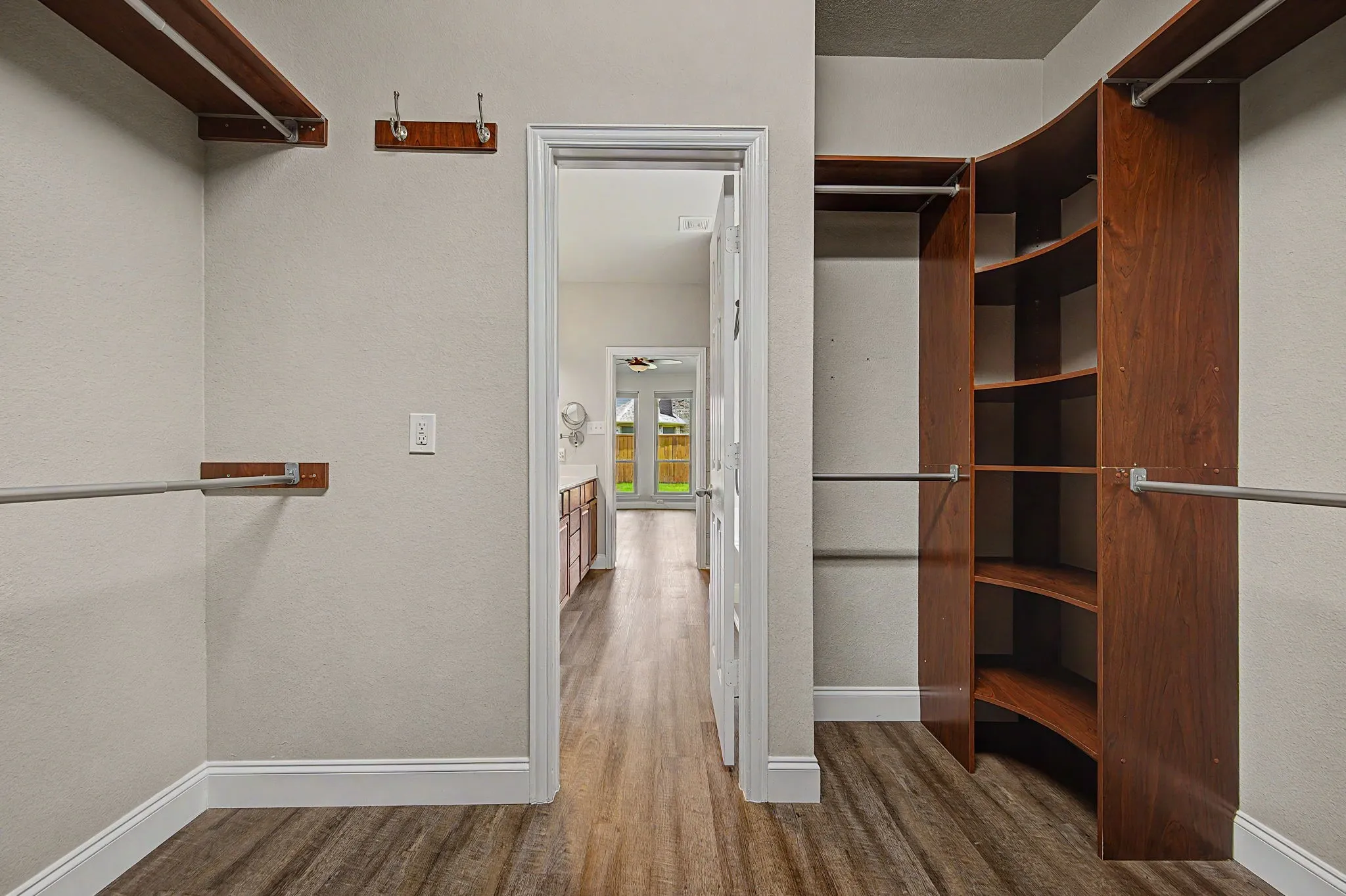 LVP FLooring continues from primary bedroom to bathroom to closet