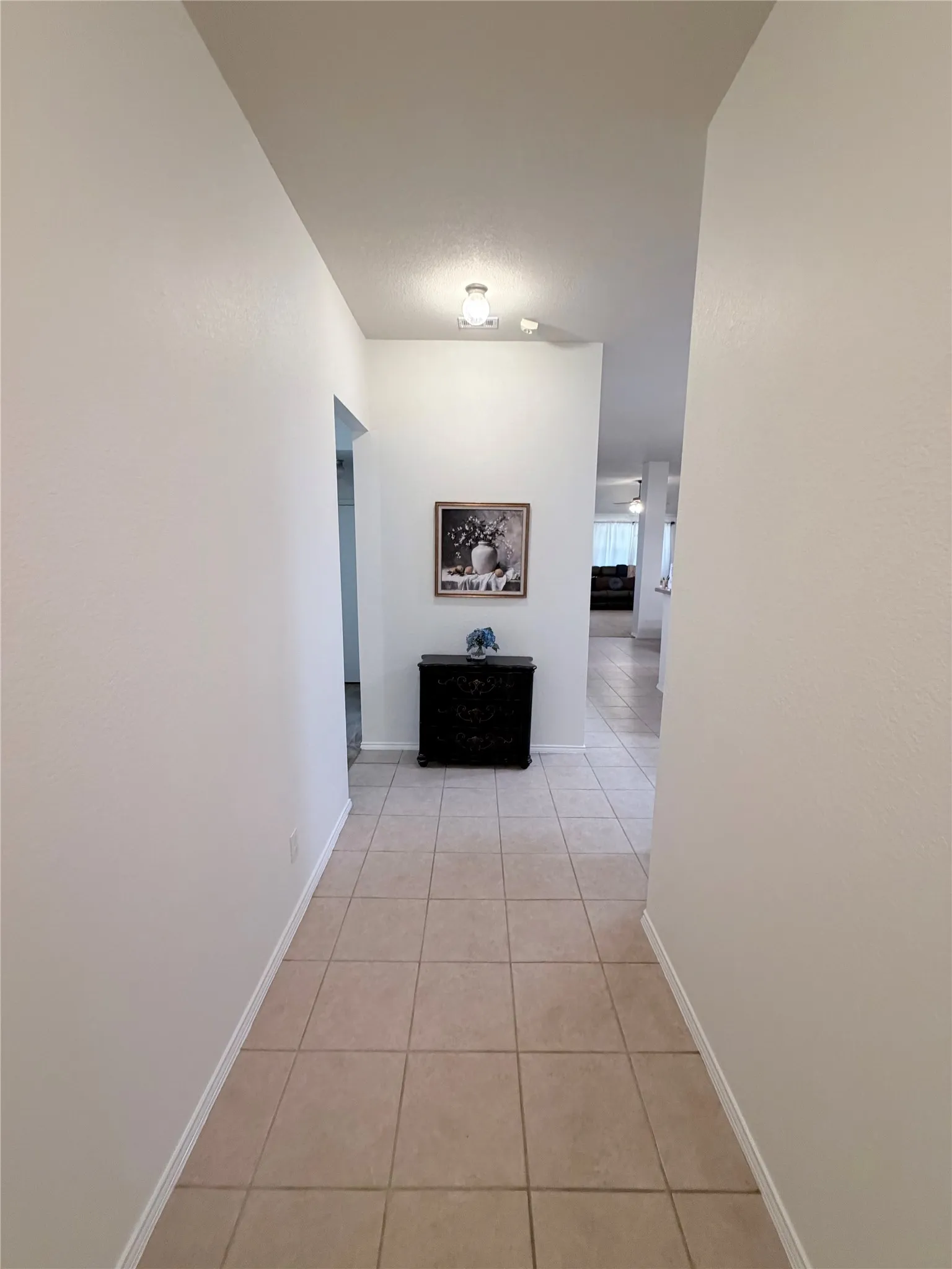 Tile flooring extending through the hallway