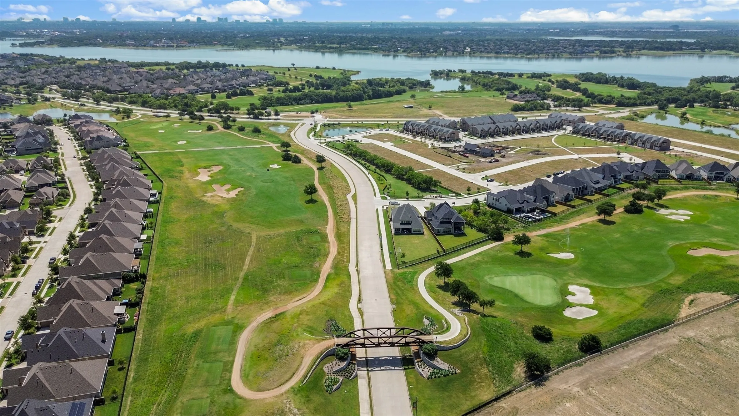 Expansive residential development featuring golf course frontage, waterways, and a variety of home styles