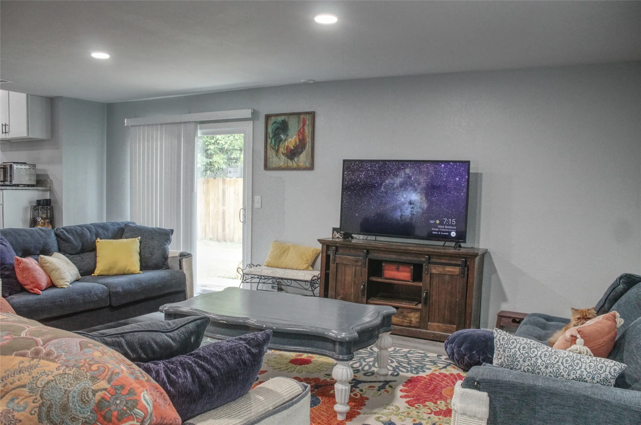 Bright living area featuring recessed lighting and light-toned wall finishes