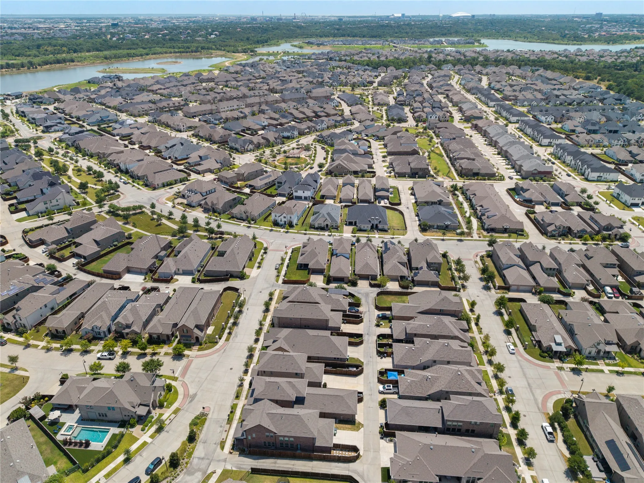 Established residential community with varied architectural styles, extensive street network, and abundant green spaces