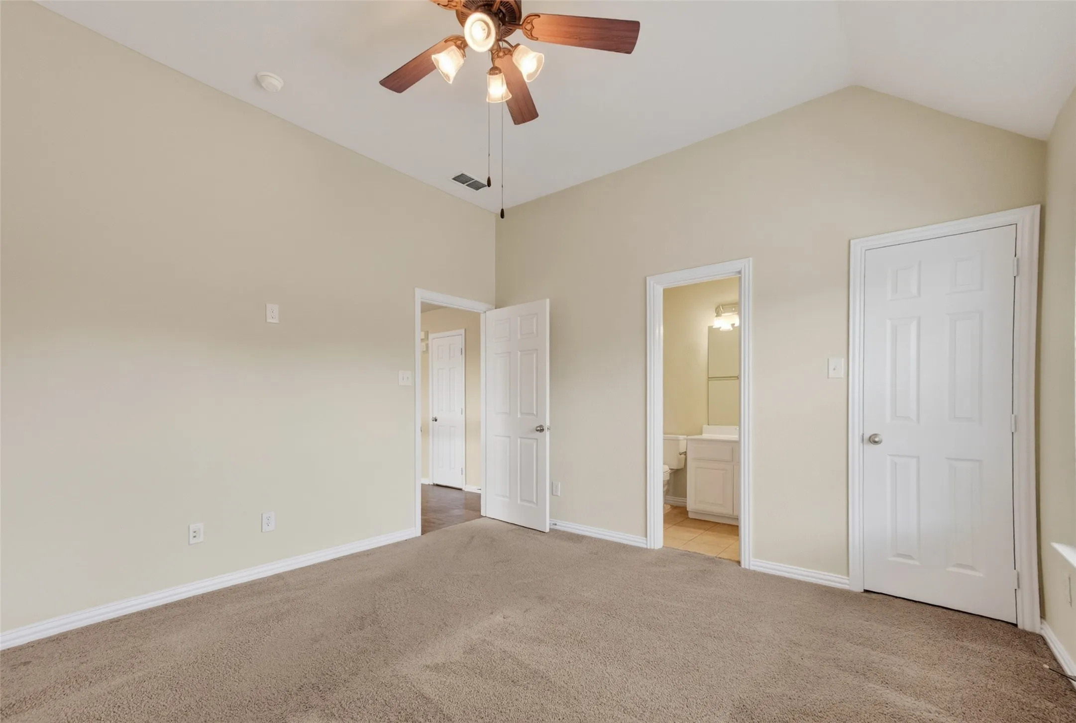 Room featuring vaulted ceilings and neutral wall tones and full bathroom (2nd floor)