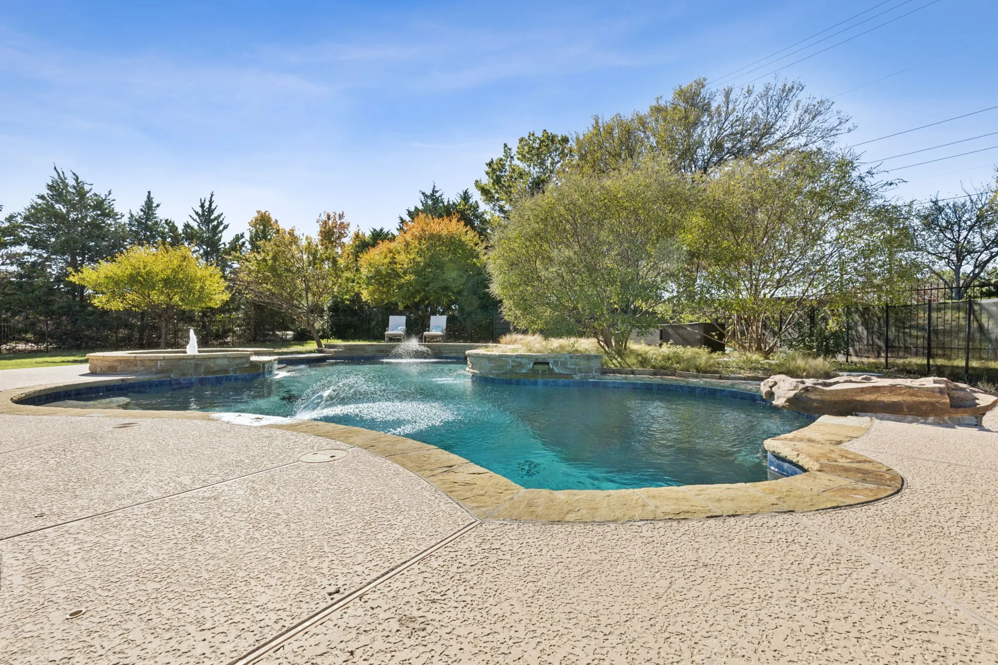 View of the pool looking toward the back of the property.