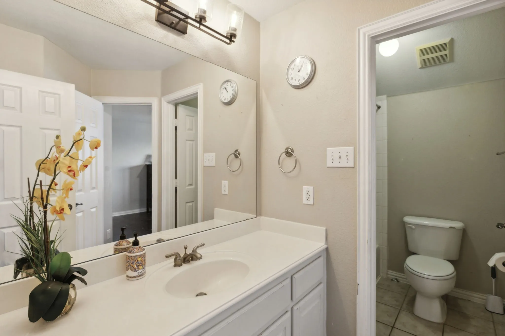Secondary bathroom on the second floor with separate water closet with tub/shower combination.