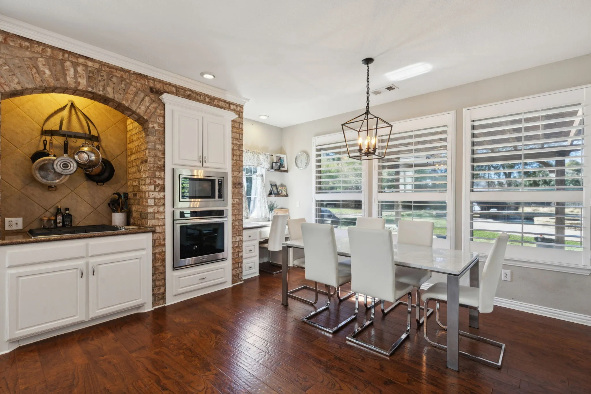 The nook area flows naturally from the kitchen, perfect for an meal at home. The wall of windows provides wonderful natural light as well as beautiful views of the backyard. A convenient desk is available for home management or homework.