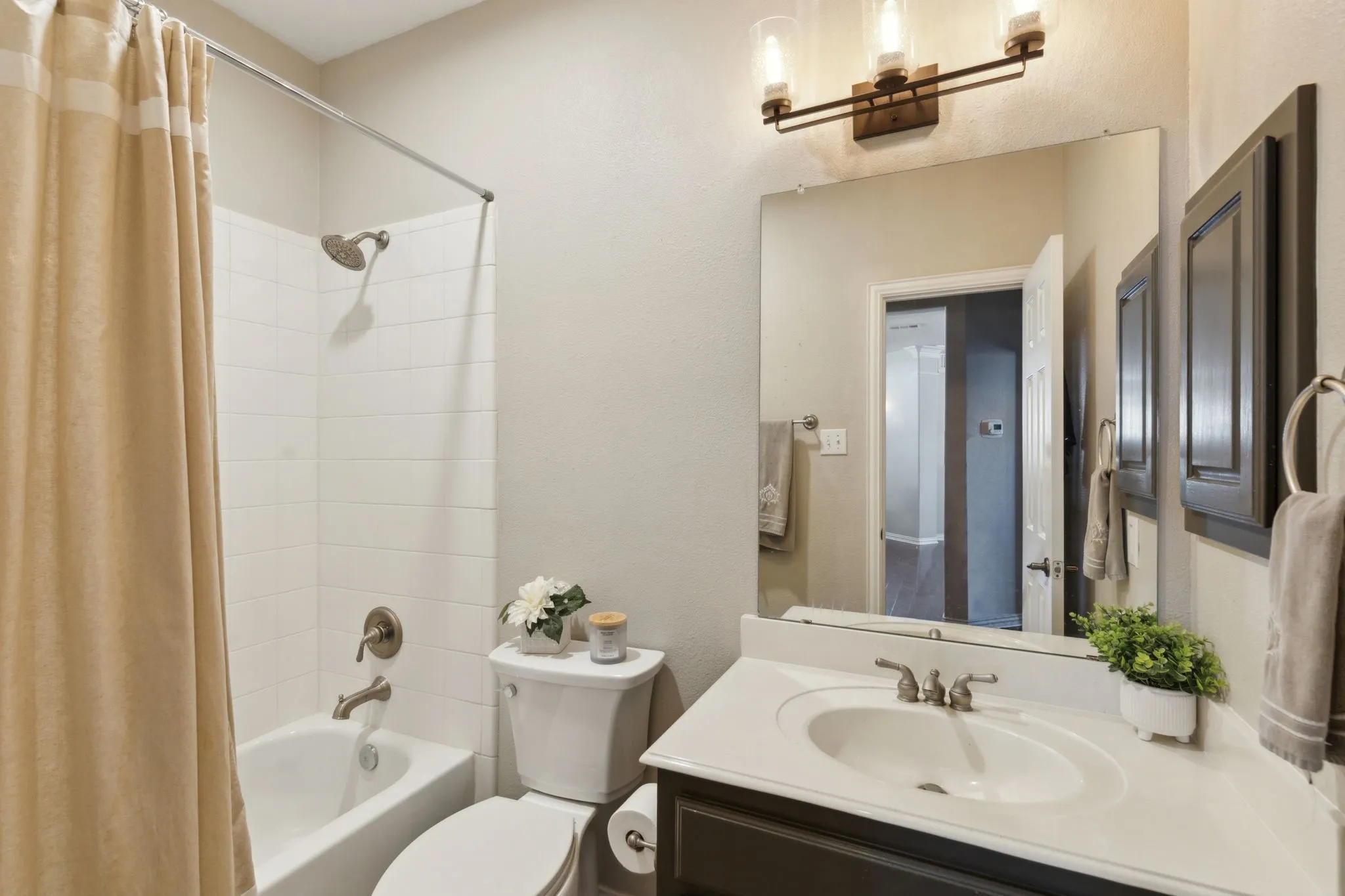 Secondary bathroom on the first floor serves as a guest bath.