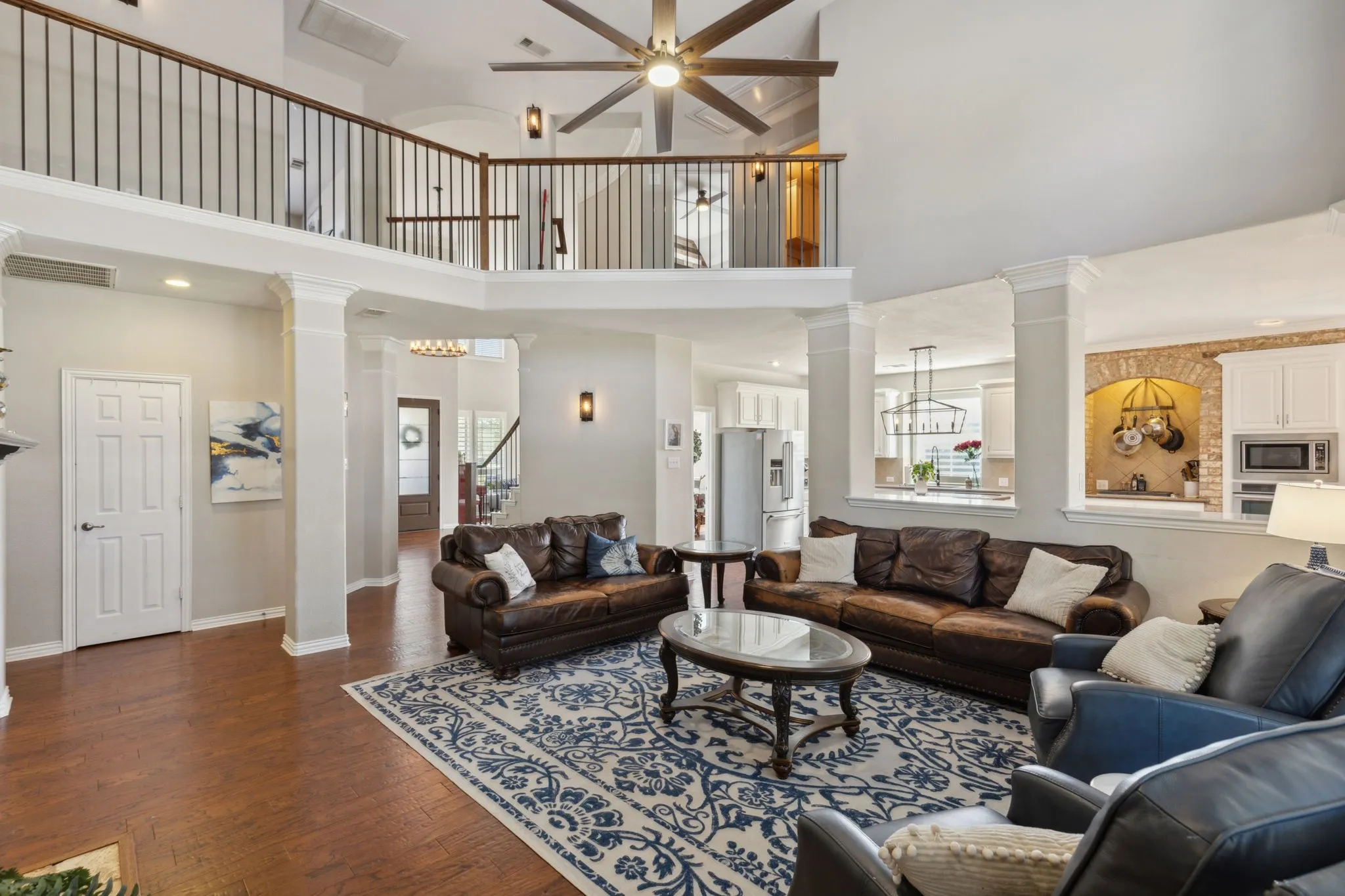 The family room has a soaring ceiling that is open to the second floor and has good, open flow to the kitchen and nook.