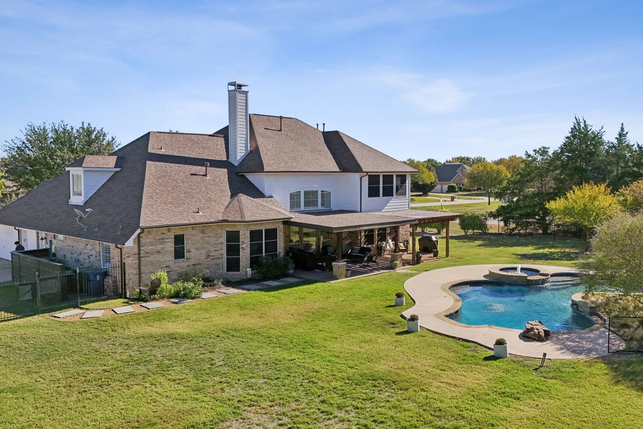 Aerial view of the backyard and pool.