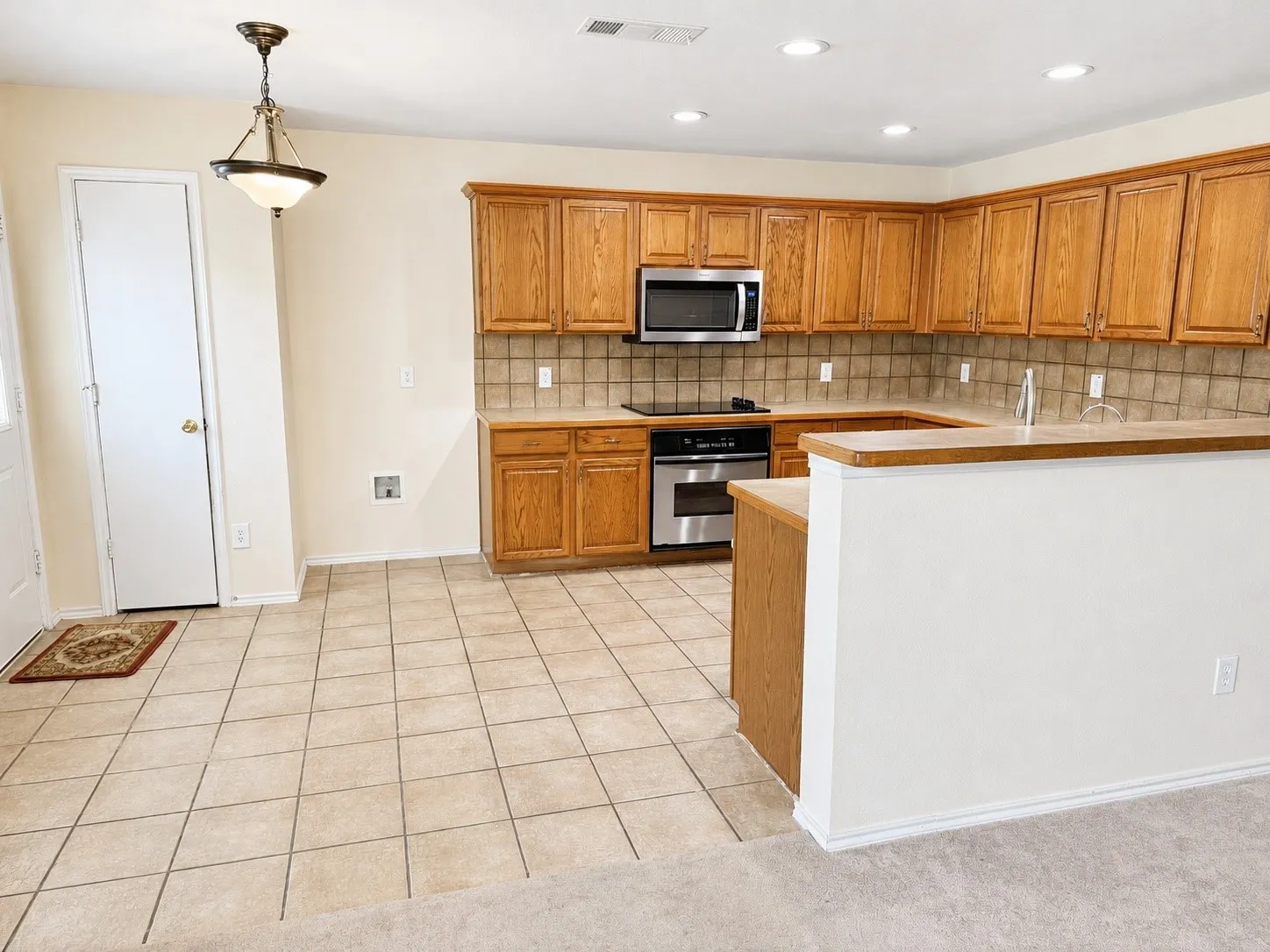 The 2nd living opens to the kitchen that includes a pantry