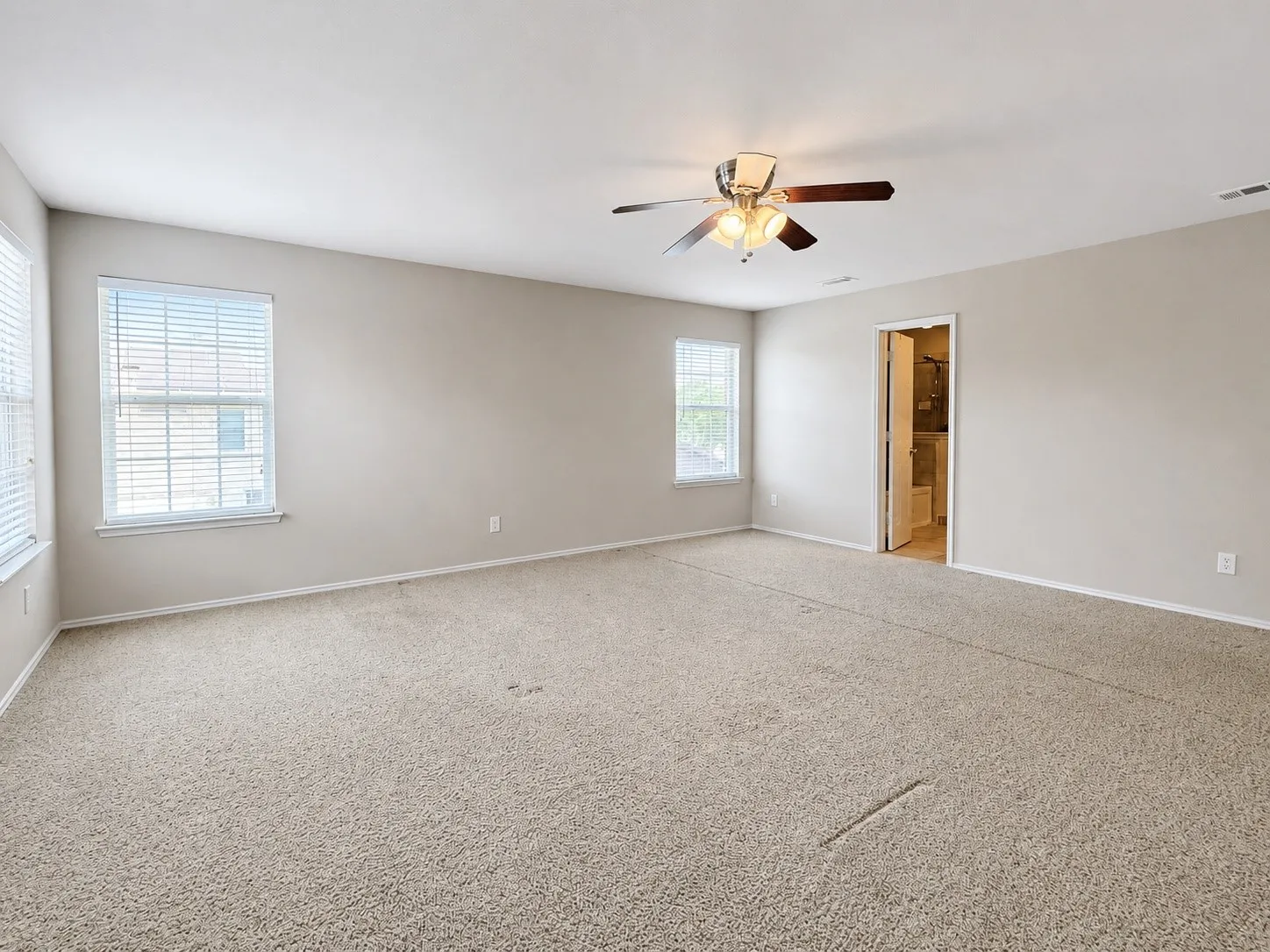 Upstairs primary bedroom is also spacious