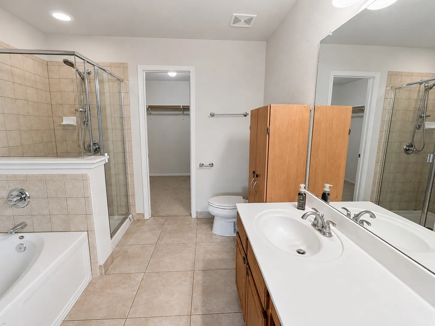 Upstairs primary bath includes separate shower and tub