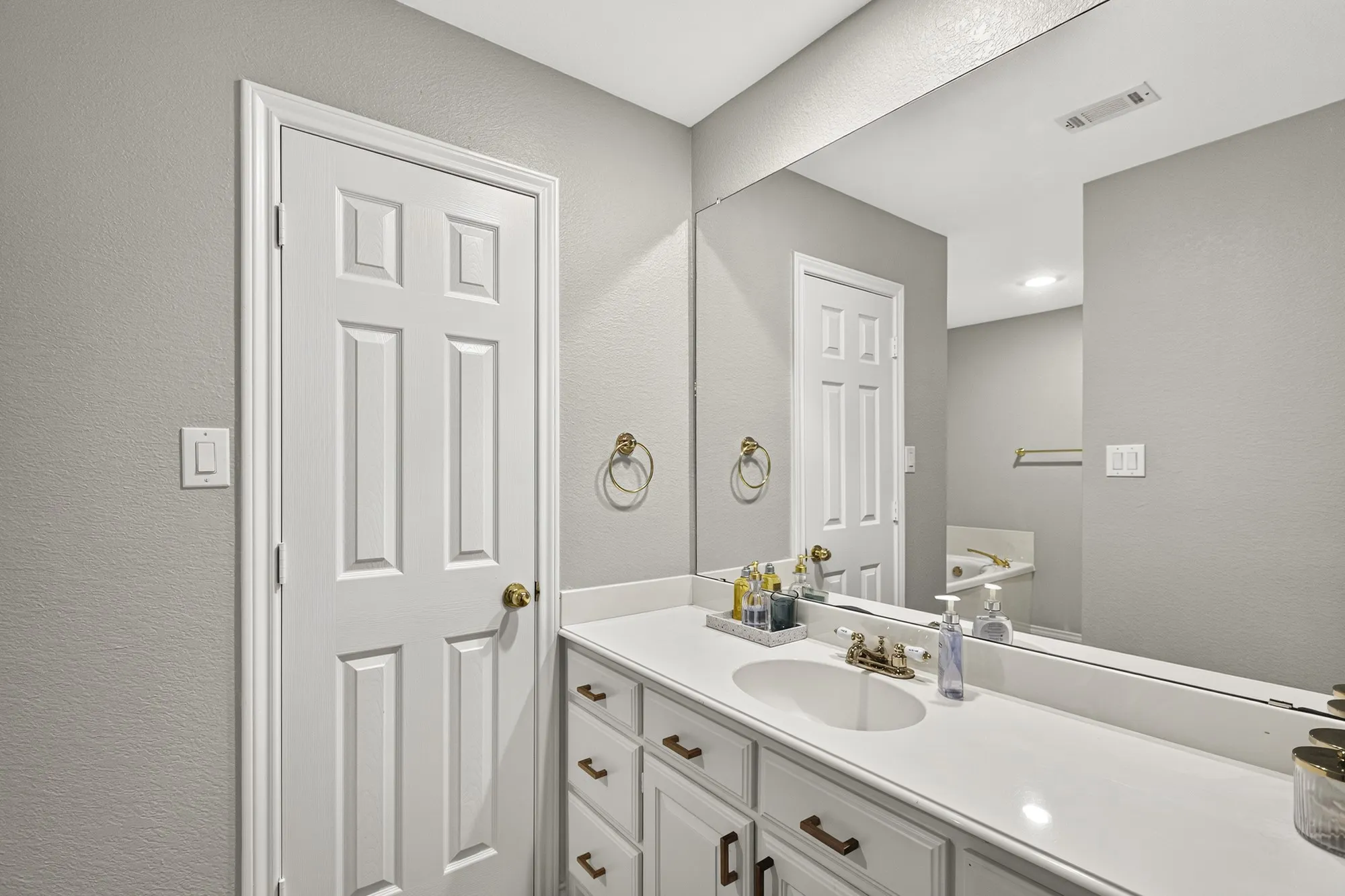Separate vanities in primary bath~