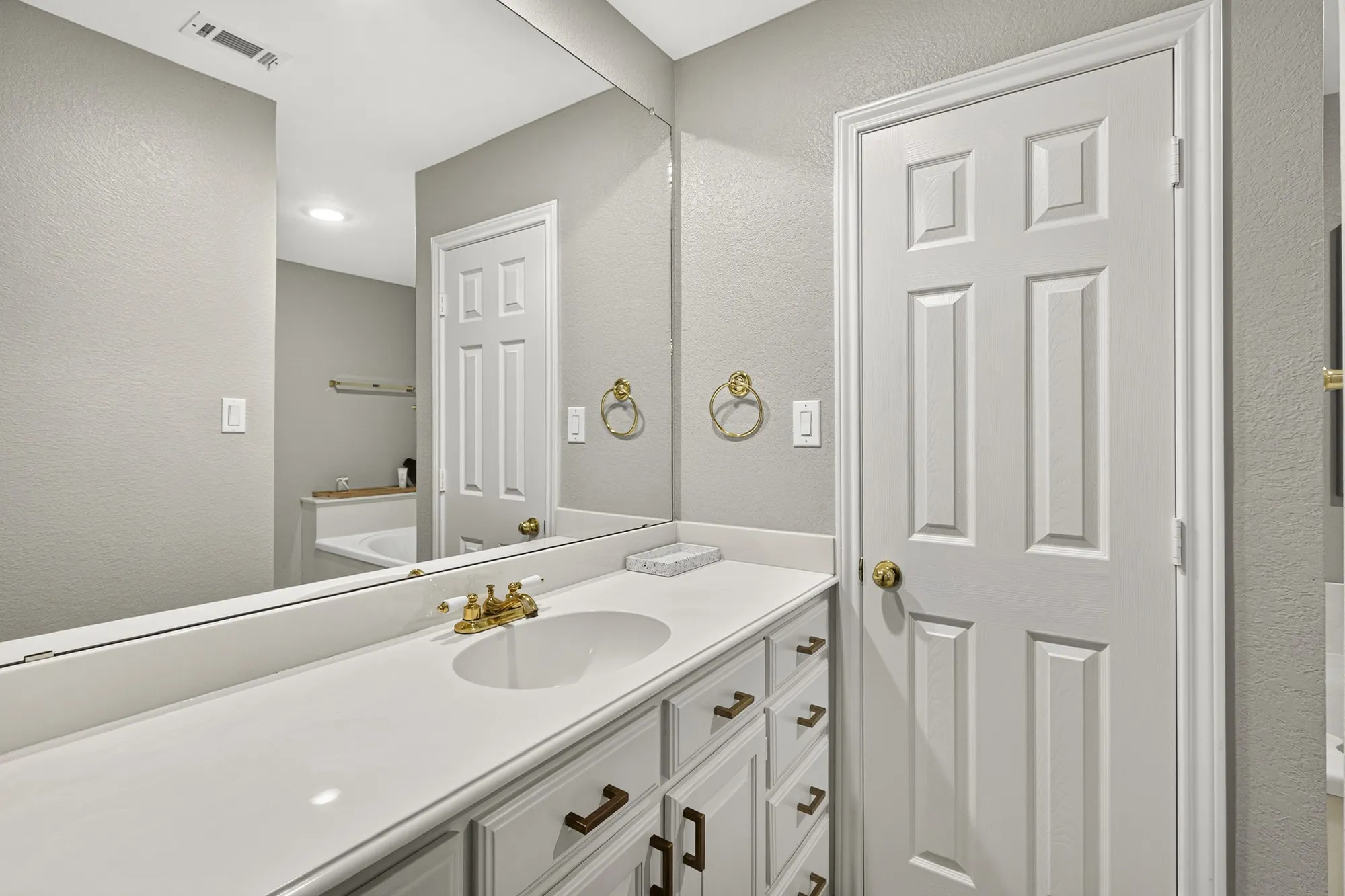 Dual closets in primary bathroom~