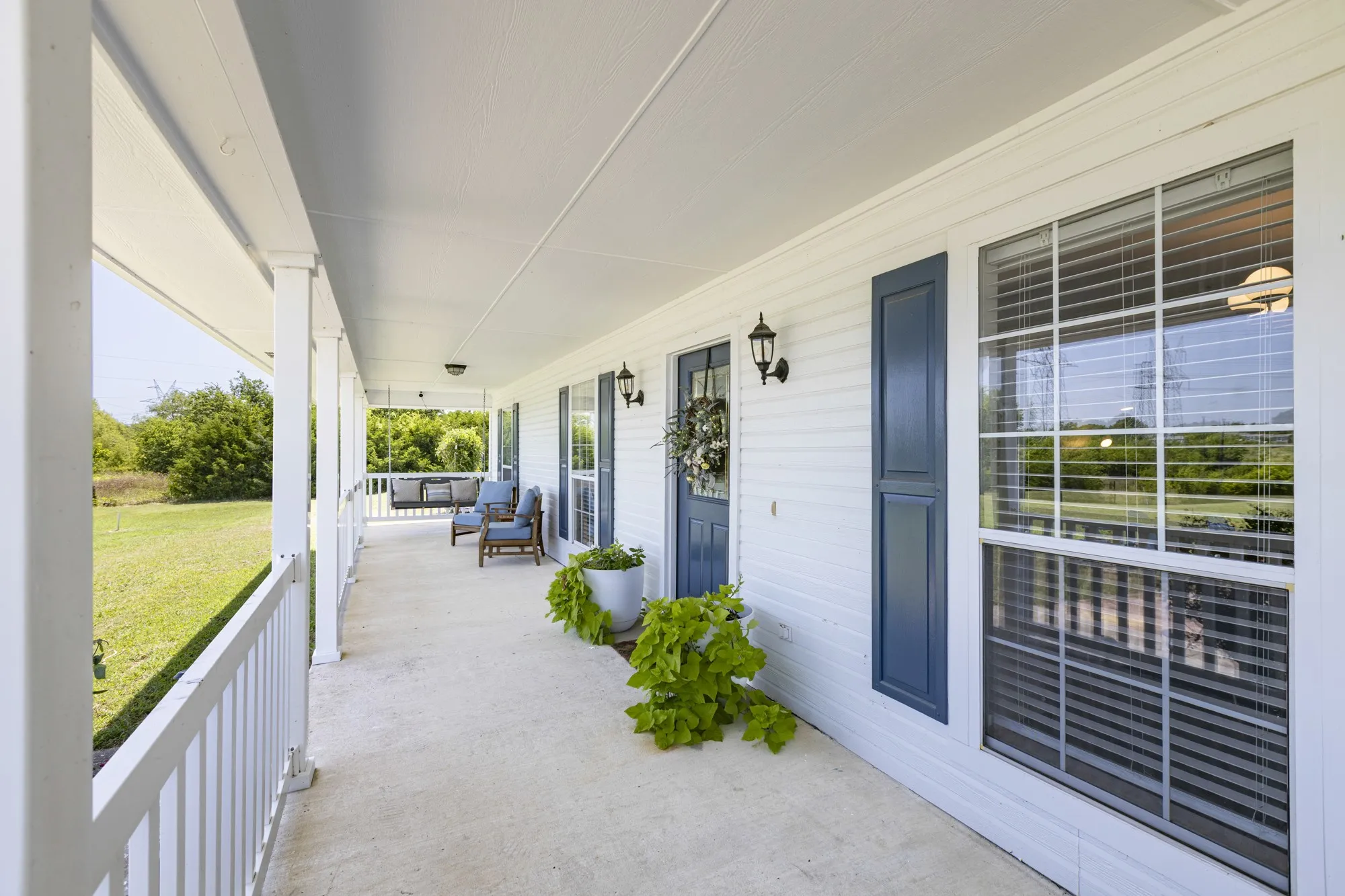 Enjoy the breezes from the front porch swing!