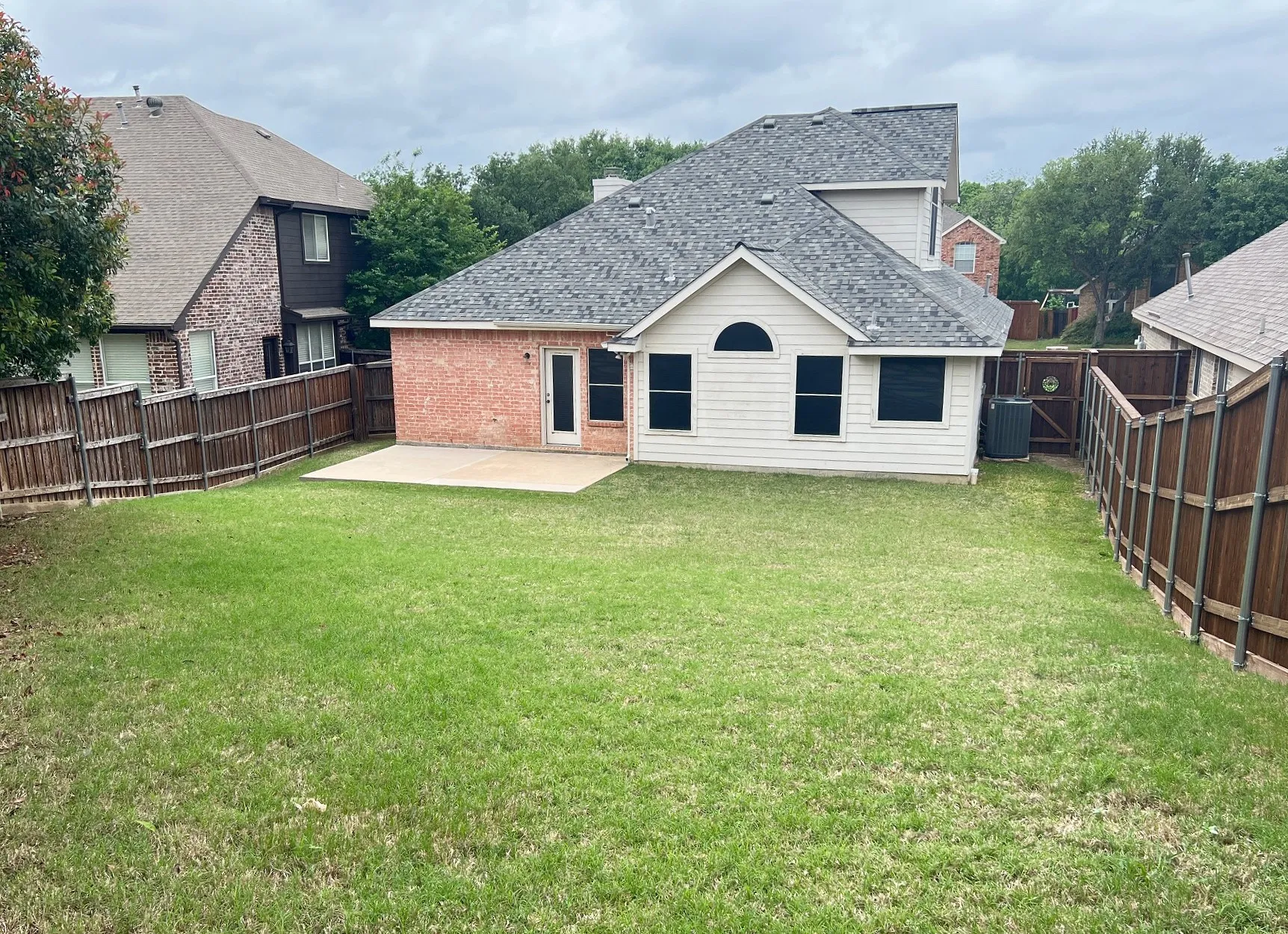 Huge backyard, wood fence, extended patio