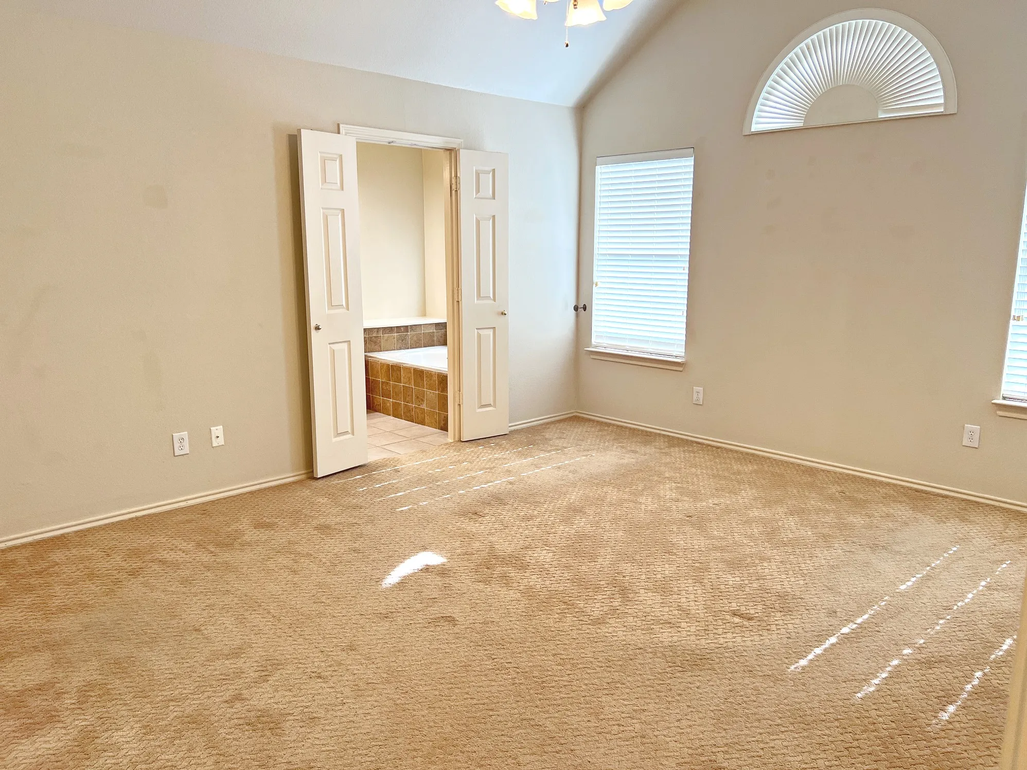 Primary bedroom with newish carpet