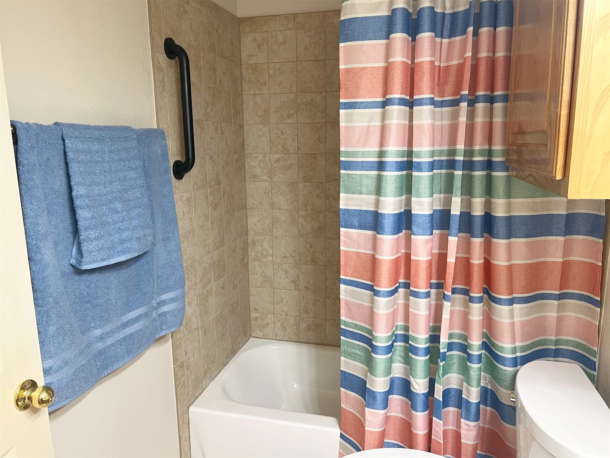 Remodeled shower bath combo in secondary bath