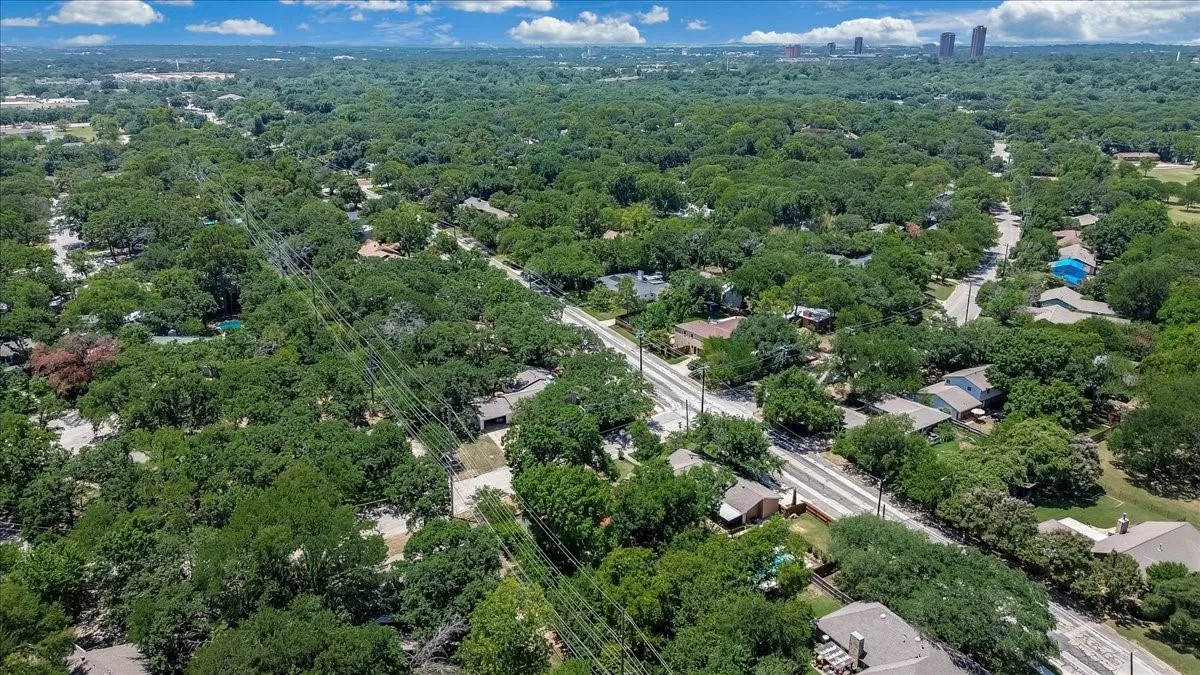 Expansive aerial perspective showcasing a verdant residential area