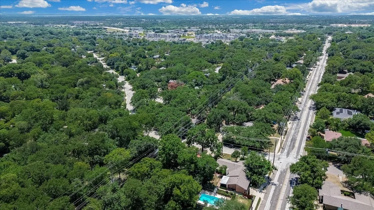 Expansive aerial panorama showcasing a tree-lined residential area