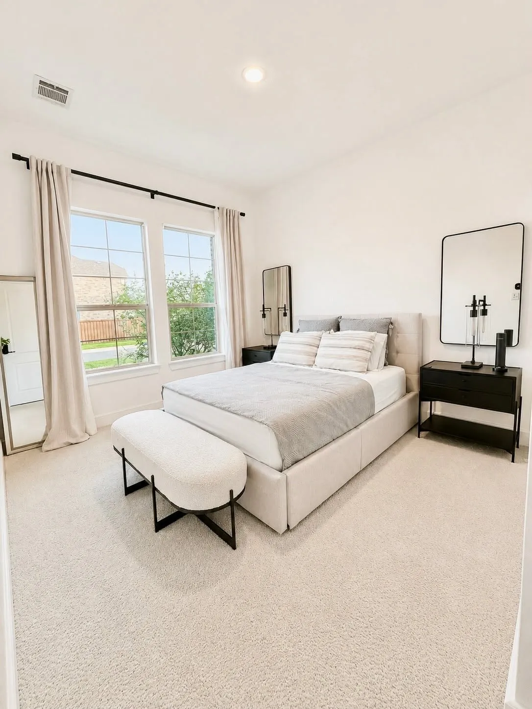 Private bedroom, full bath, and separate living room ideal for multigenerational living or guests.