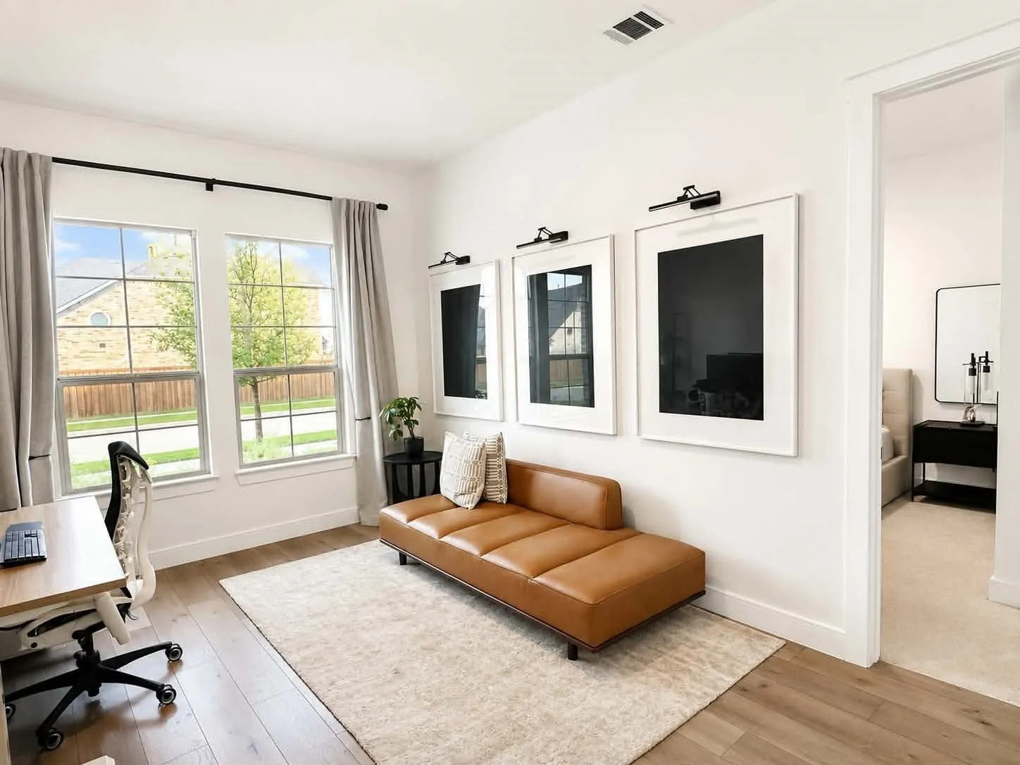 Private bedroom, full bath, and separate living room ideal for multigenerational living or guests.
