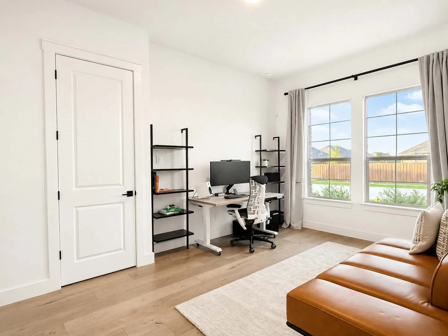 Private bedroom, full bath, and separate living room ideal for multigenerational living or guests.