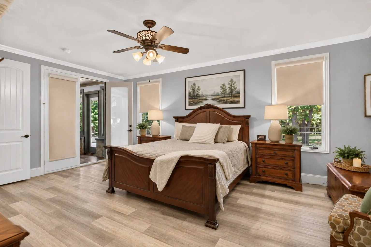 Primary bedroom with French doors to the sunroom