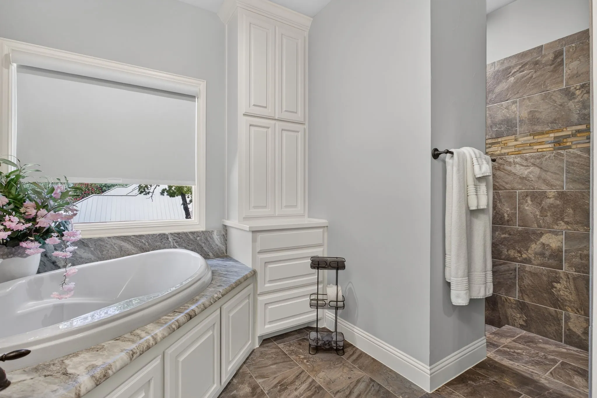 Hallway bathroom with soaking tub and walk in shower