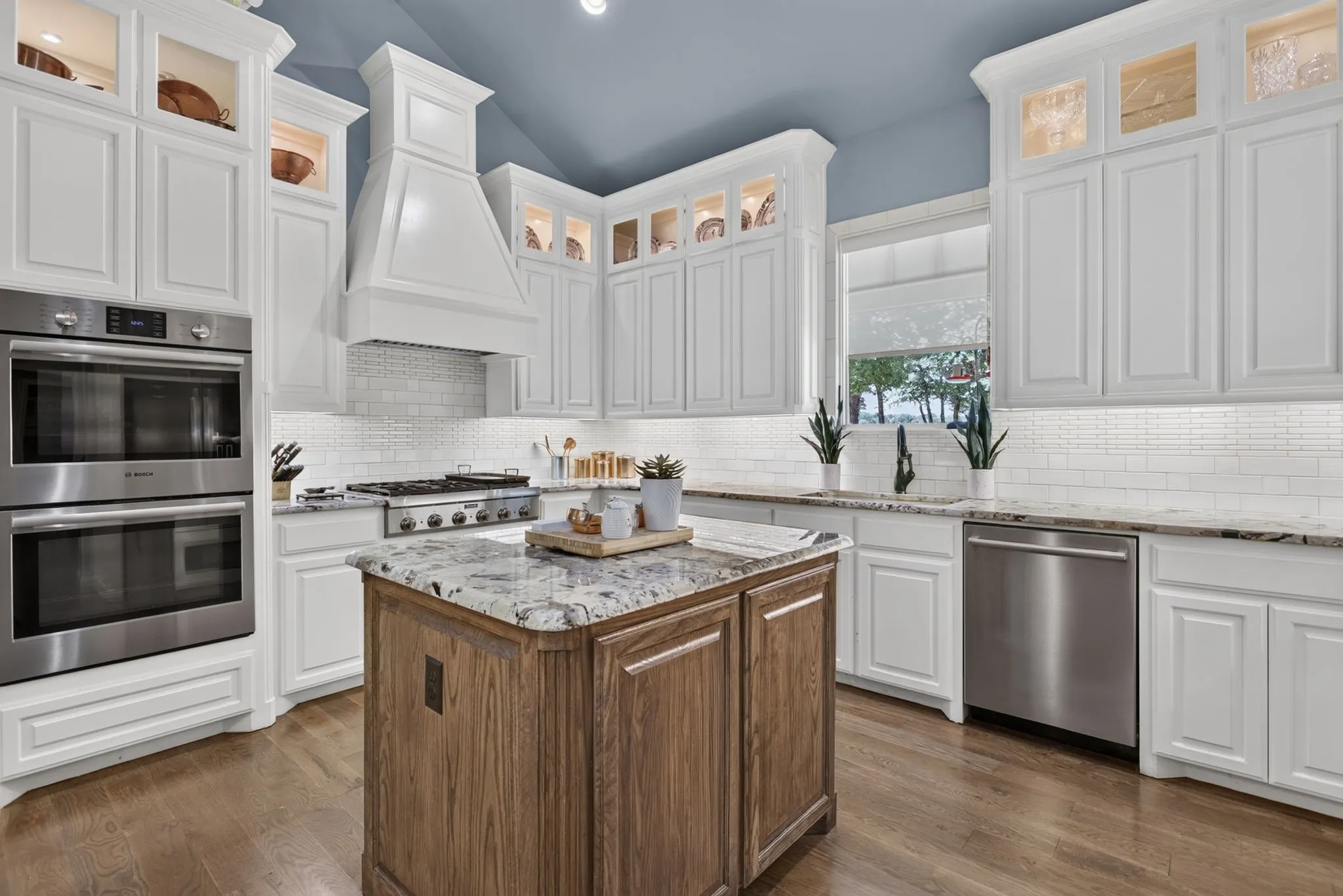 beautiful custom cabinetry Double Bosch ovens Thermador 6 burner gas stove