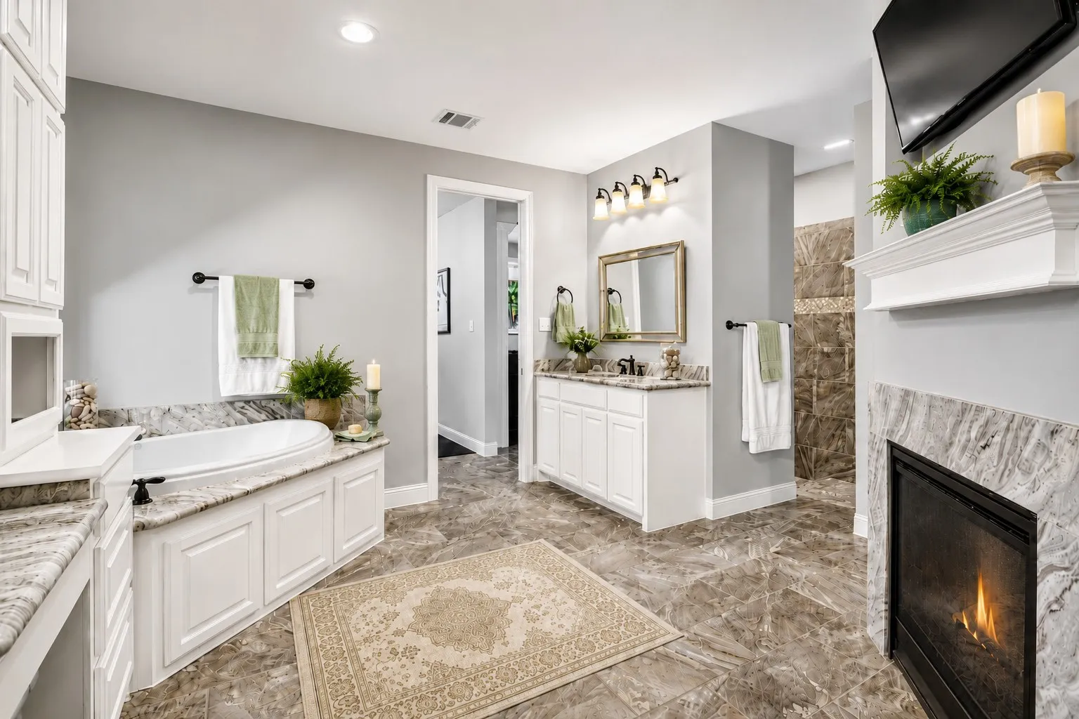 Luxurios primary bath with fireplace
