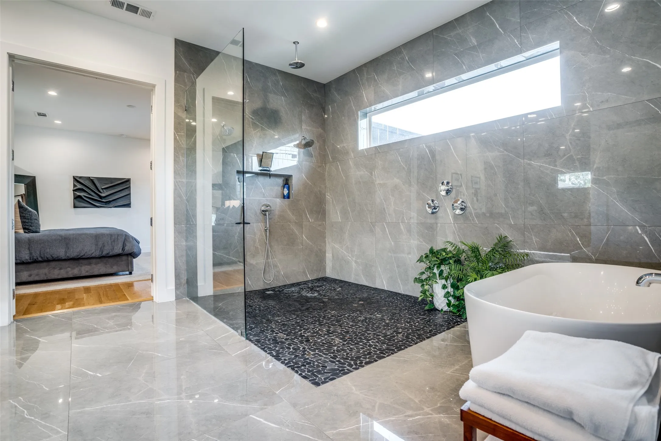 Never run out of hot water in you luxurious shower with the Rheem tankless water heater. Designer Delta Trinisc plumbing fixtures and Kinetic rain can shower heads