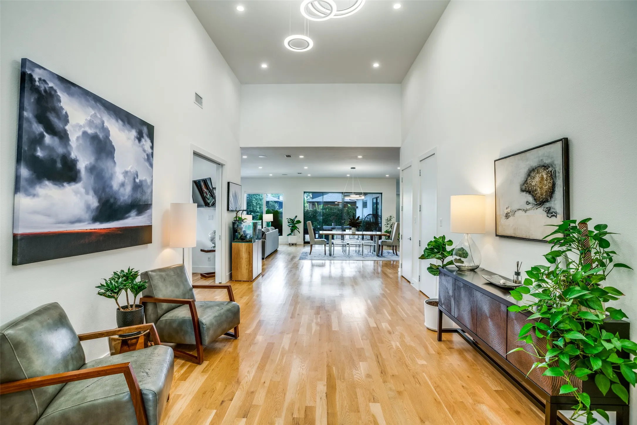 Foyer leads to open living-dining-kitchen with spectcular view of the outdoor area.
