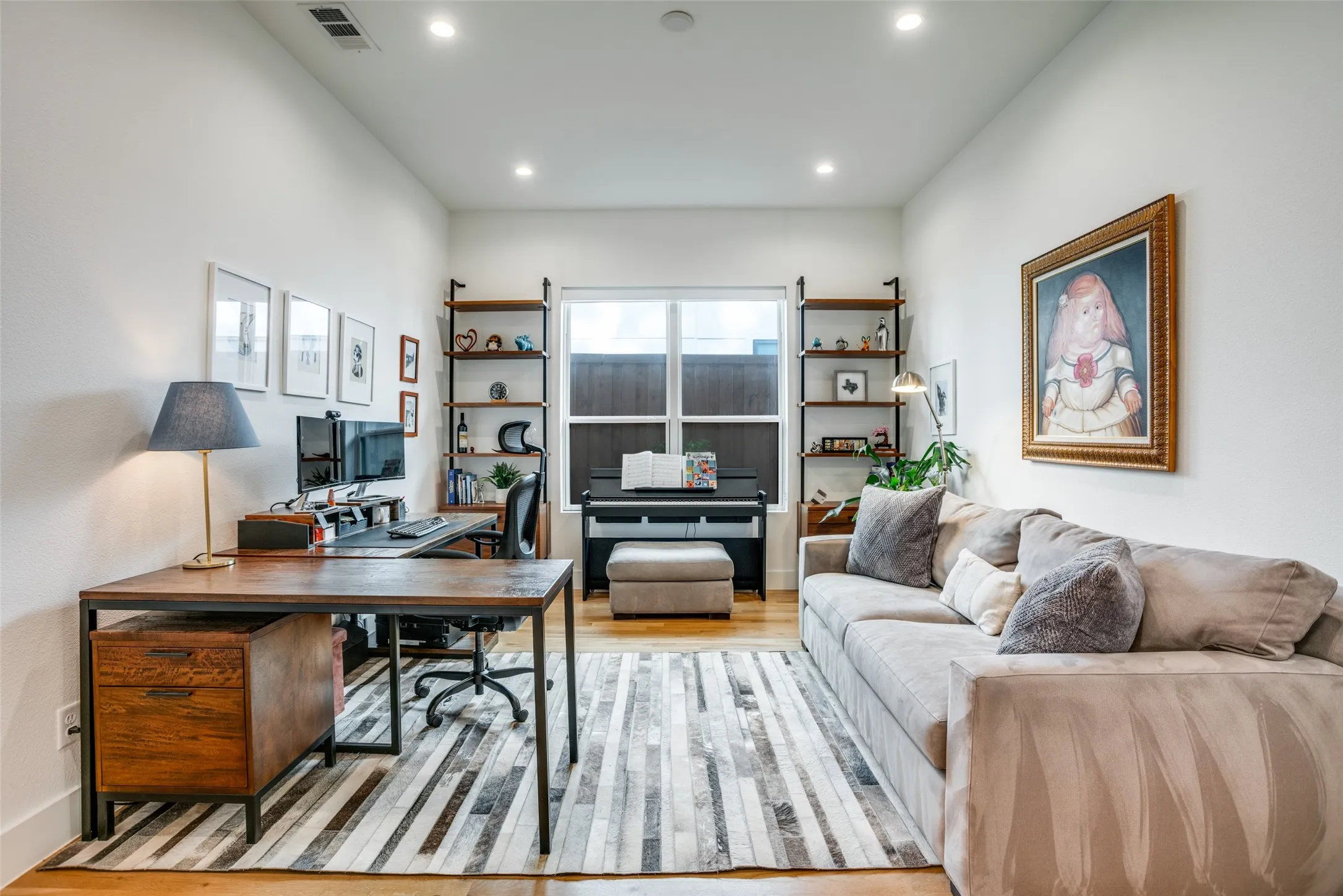 Office/Bedroom with easy access to connected bathroom. It featuries light wood finished floors a large low e3 double paned windows and recessed lighting.