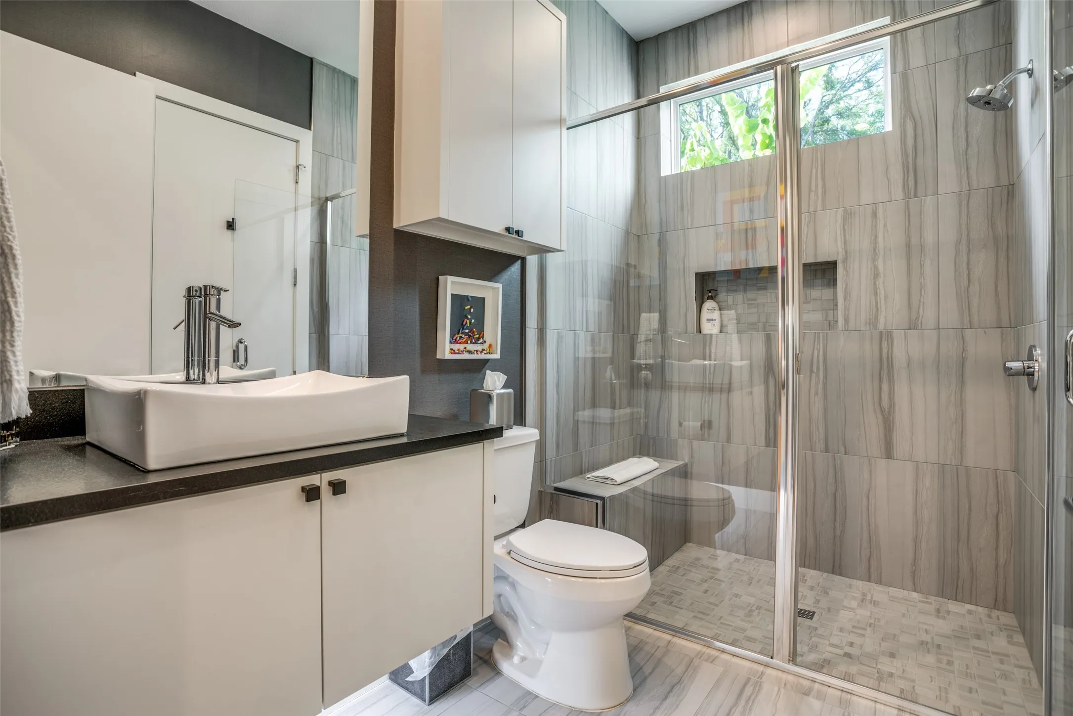 Bathroom with vanity and a shower stall