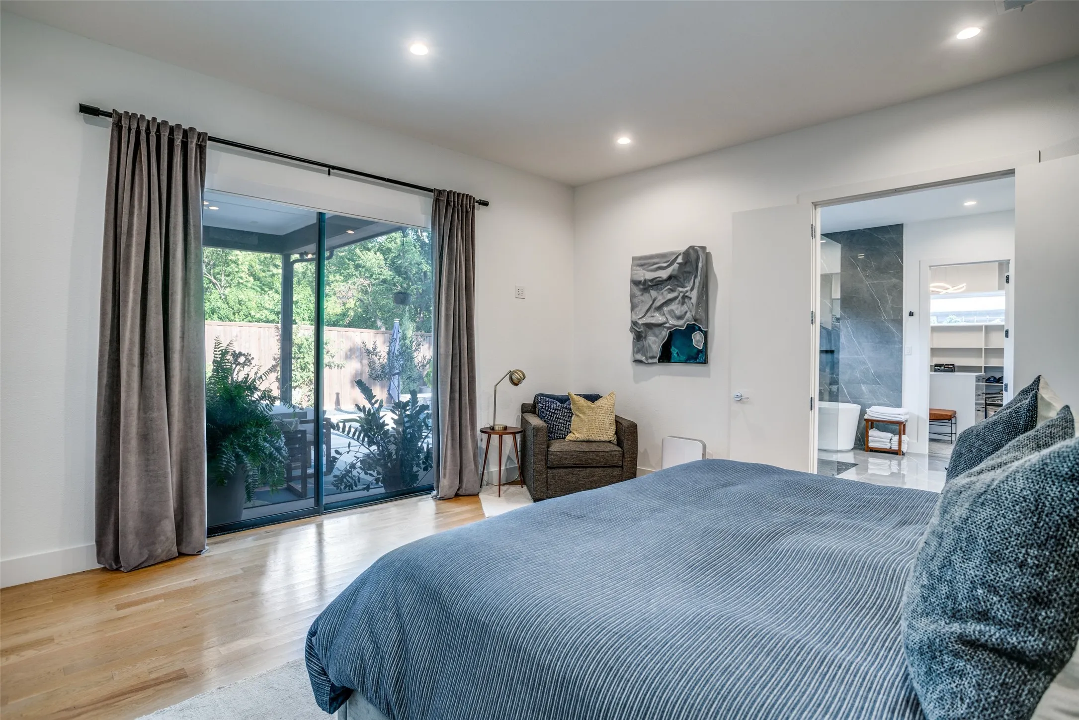Bedroom has full length sliding doors allowing easy access to outdoor area.
