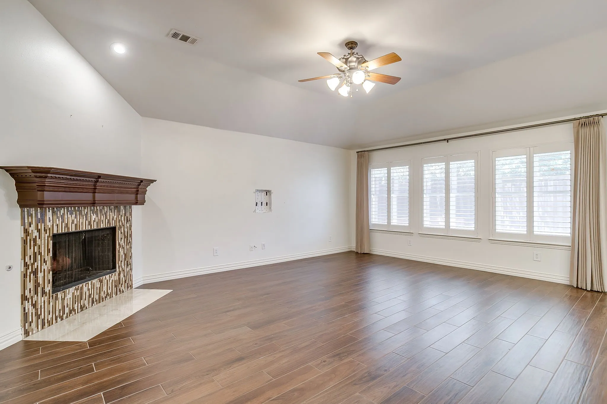 Spacious living room with wood burning fireplace