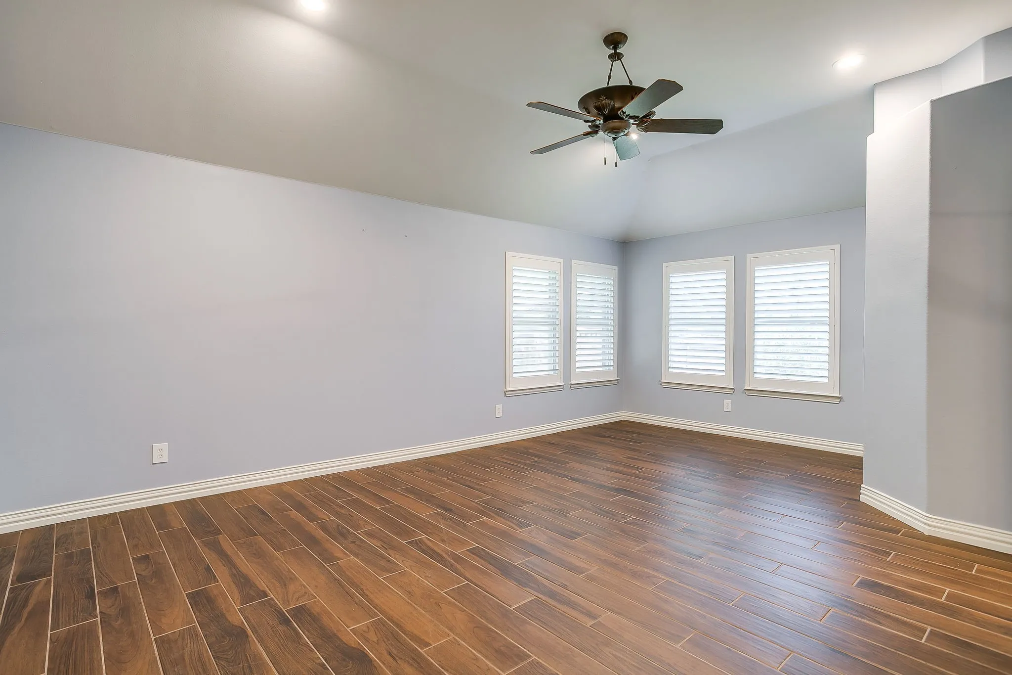 The large primary bedroom has space for sitting area