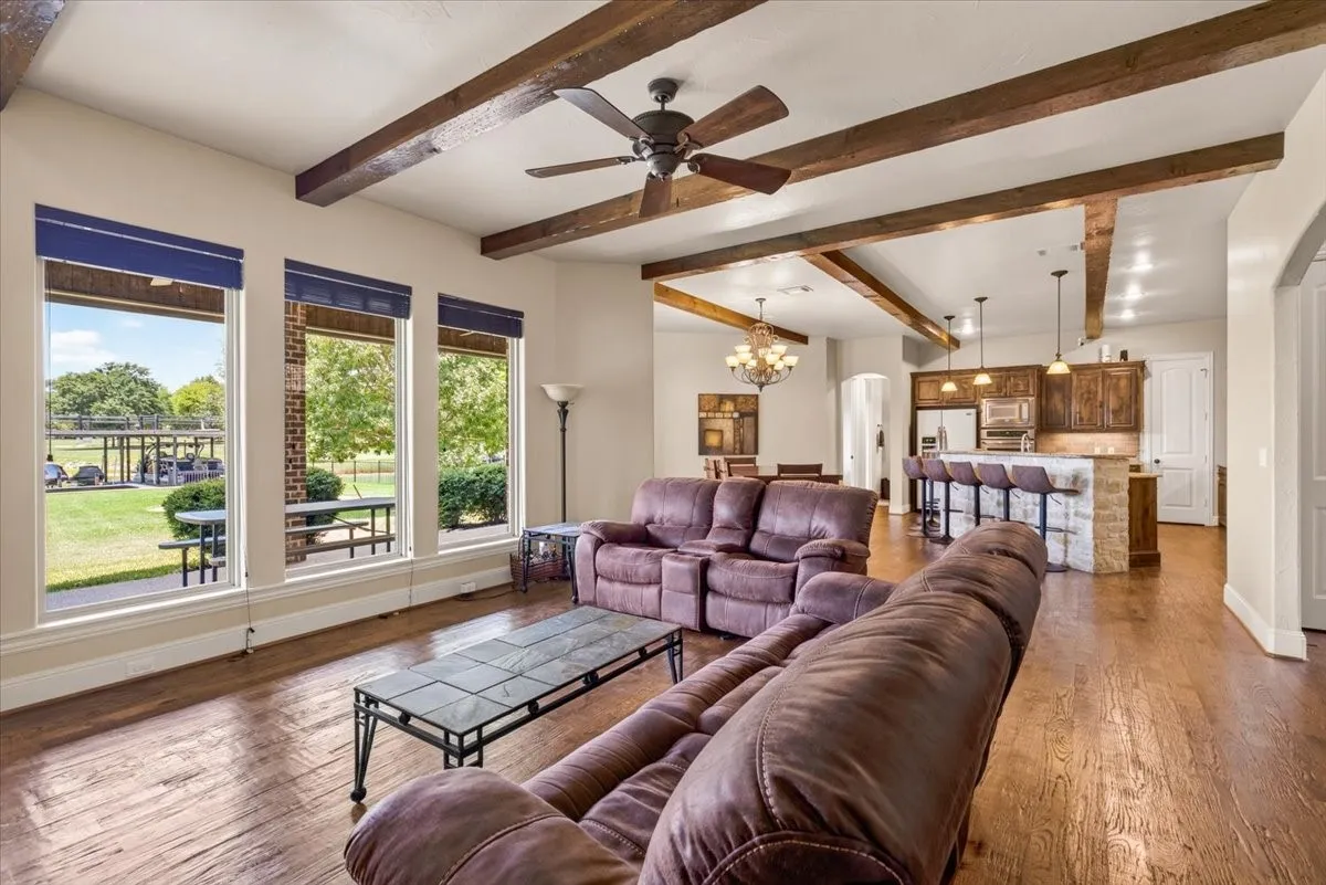 Dramatic heavy scraped beam ceilings in main living space.
