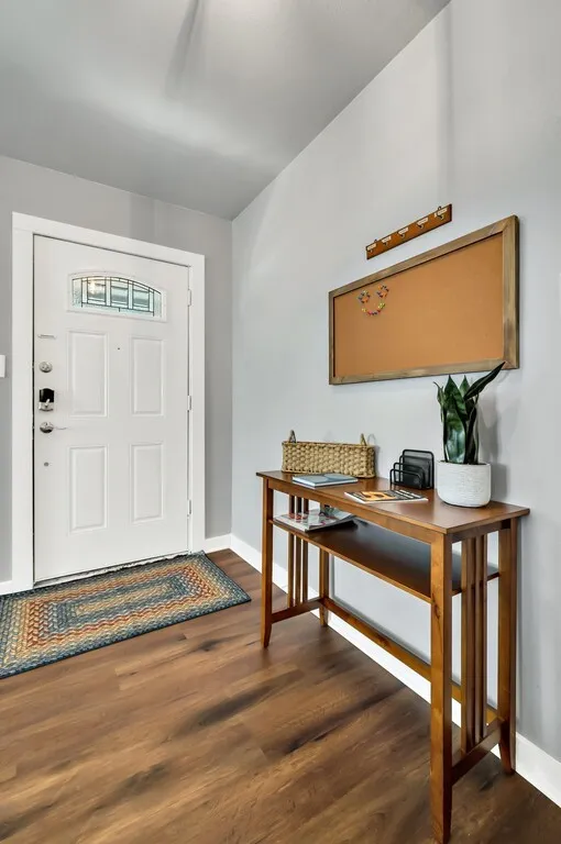 Entryway featuring a paneled door